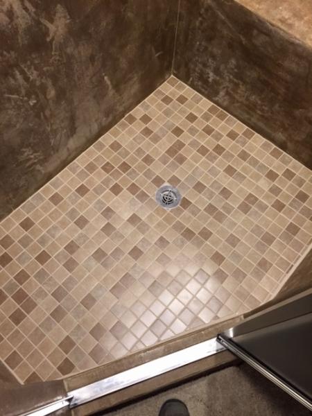 Walk-in showers are great for bathrooms and laundry rooms alike, using tile is perfect for wet areas.