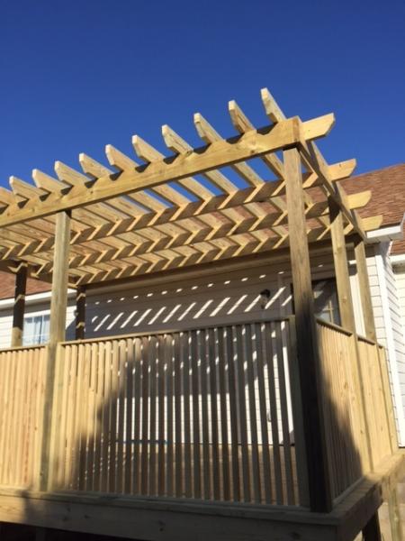 We can build a pergola in your backyard to shade a stone patio or wood deck using wood beams and lattice set on classical style columns.